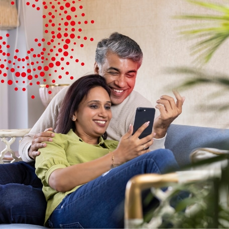 Elderly couple in a room with a telephone